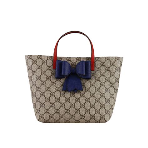 gucci shoppung bag|Gucci shopping bag in store.